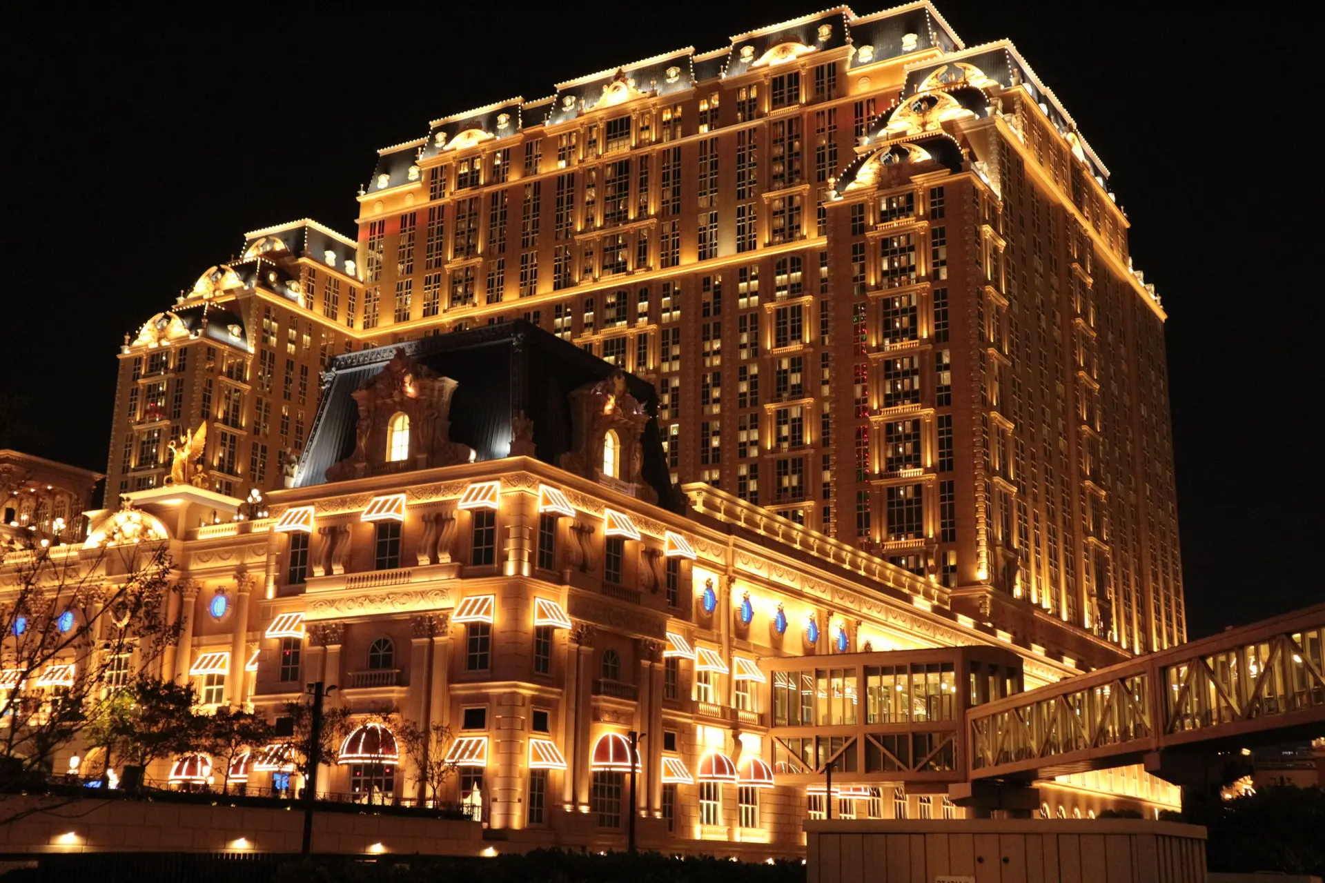 Grand architecture of world class resort hotel exterior at dusk