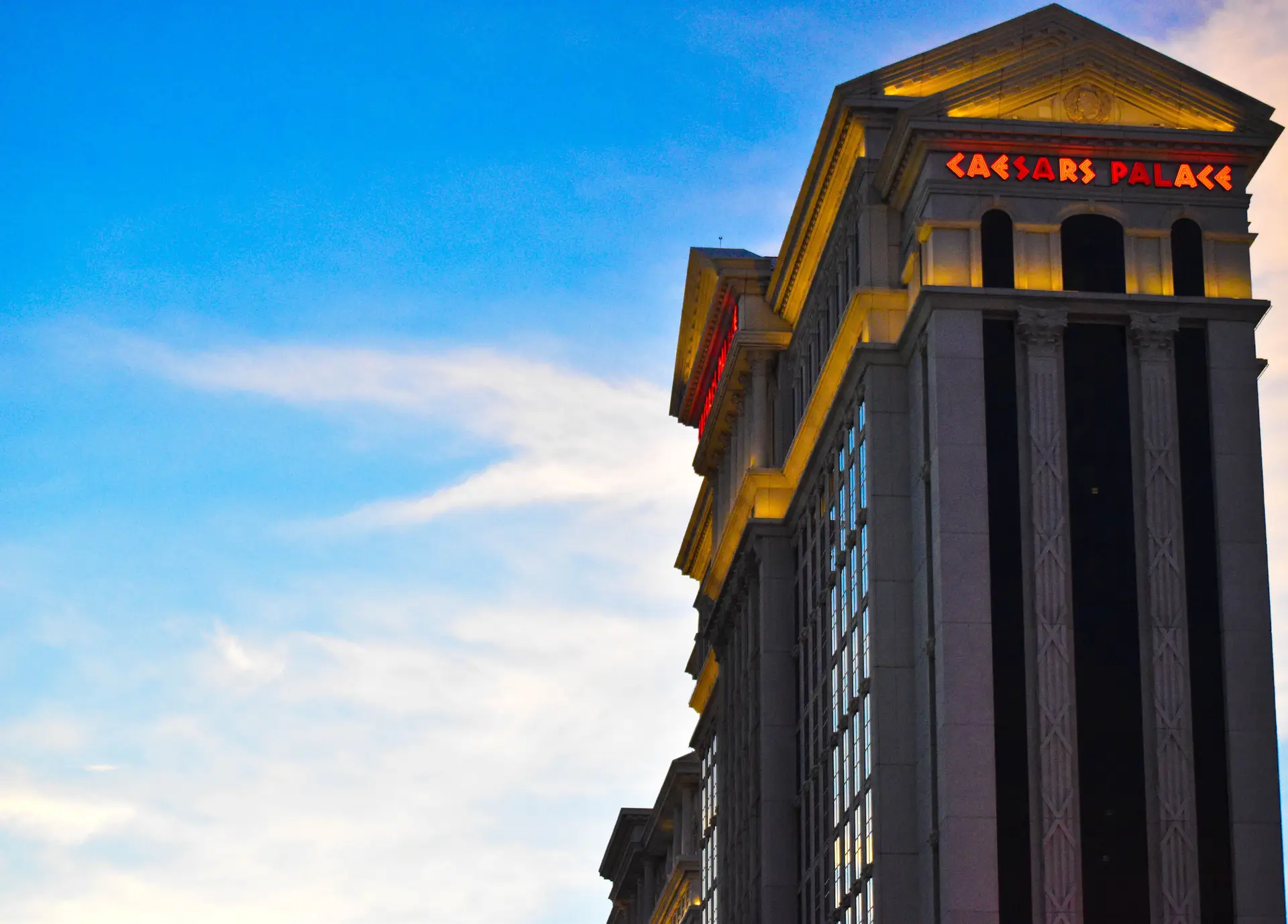 Golden evening light over palm-lined luxury casino architecture