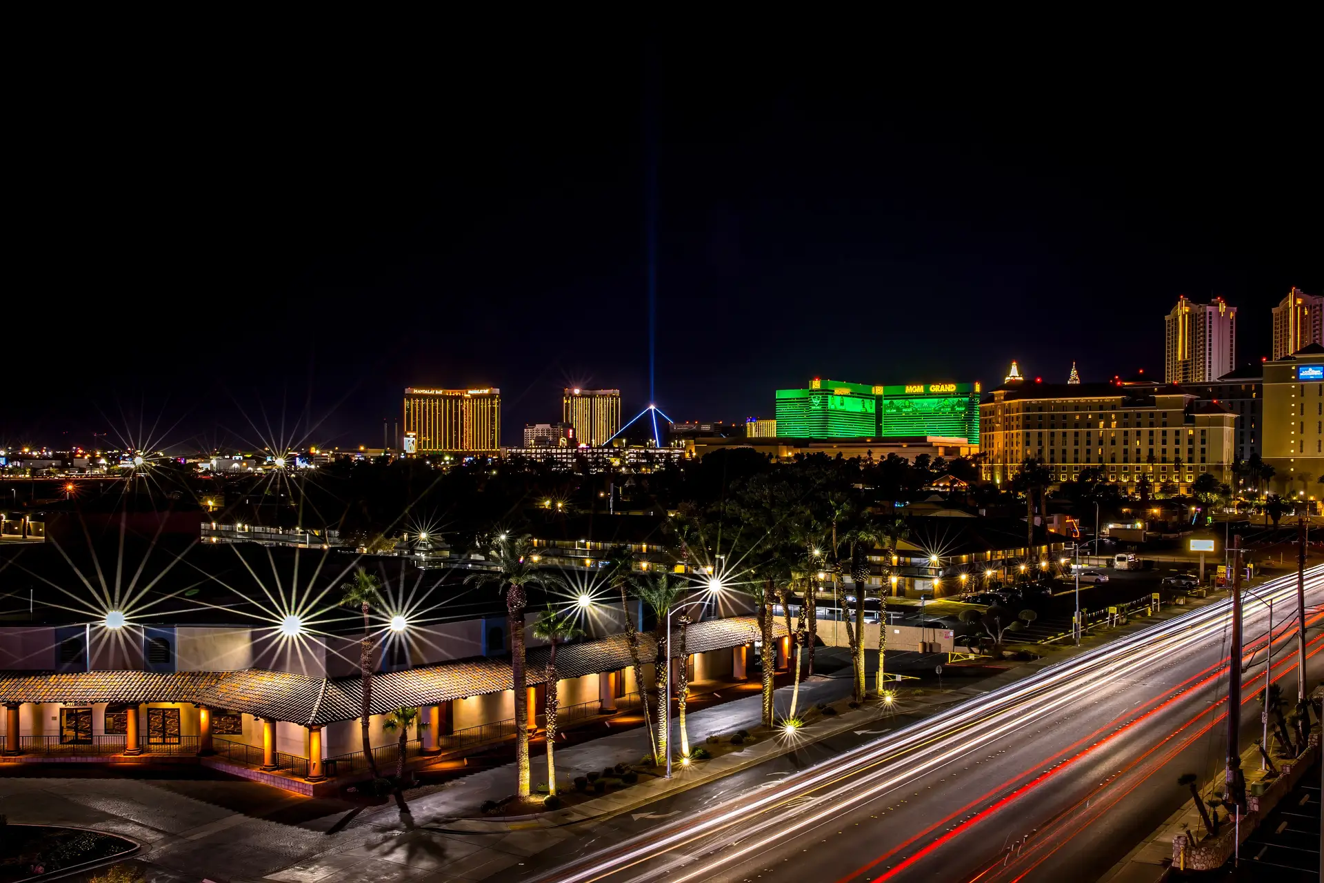 Vibrant cityscape and luxury resort skyline at night with luminous avenues