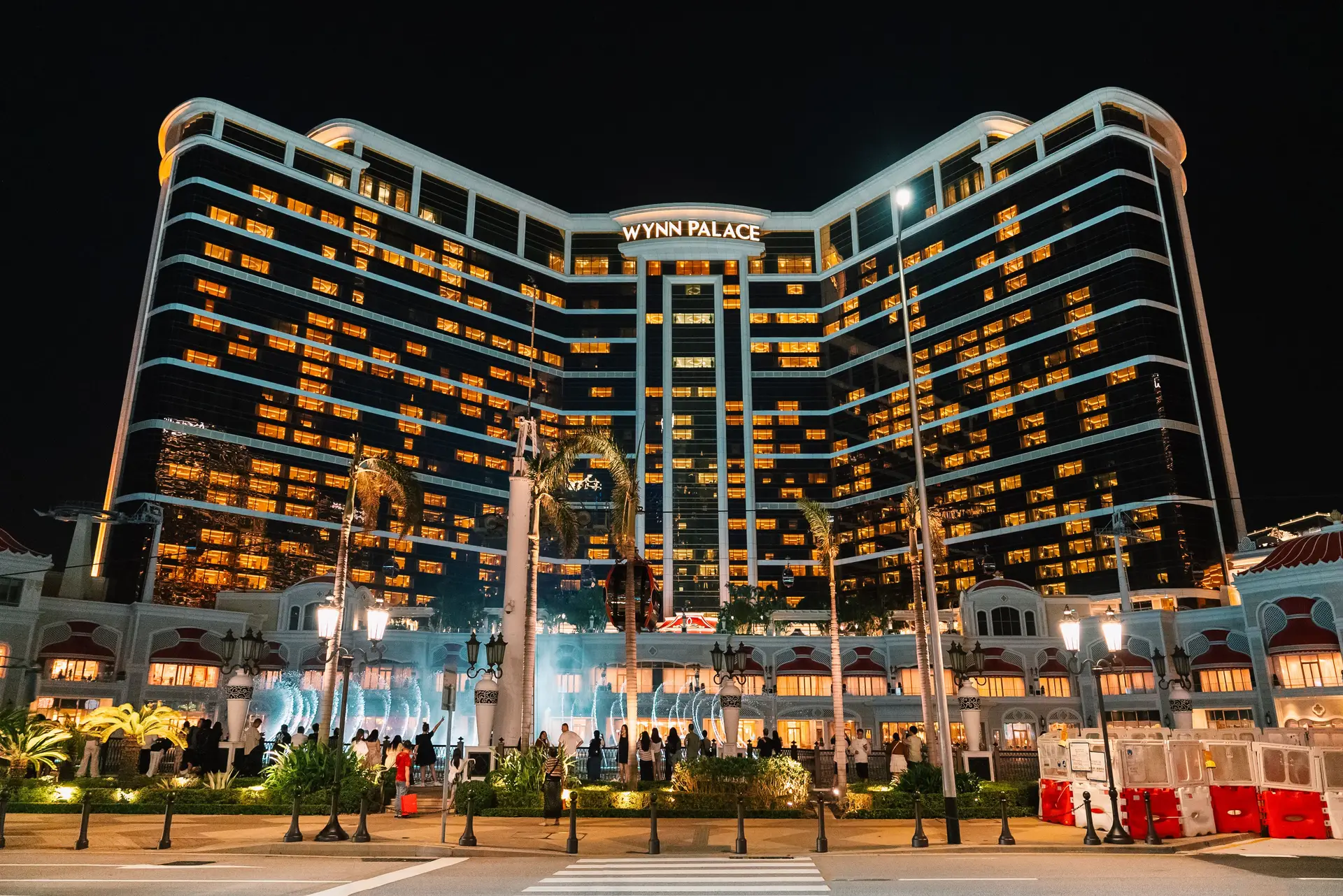 Opulent water fountain and exterior facade of Wynn Palace resort casino