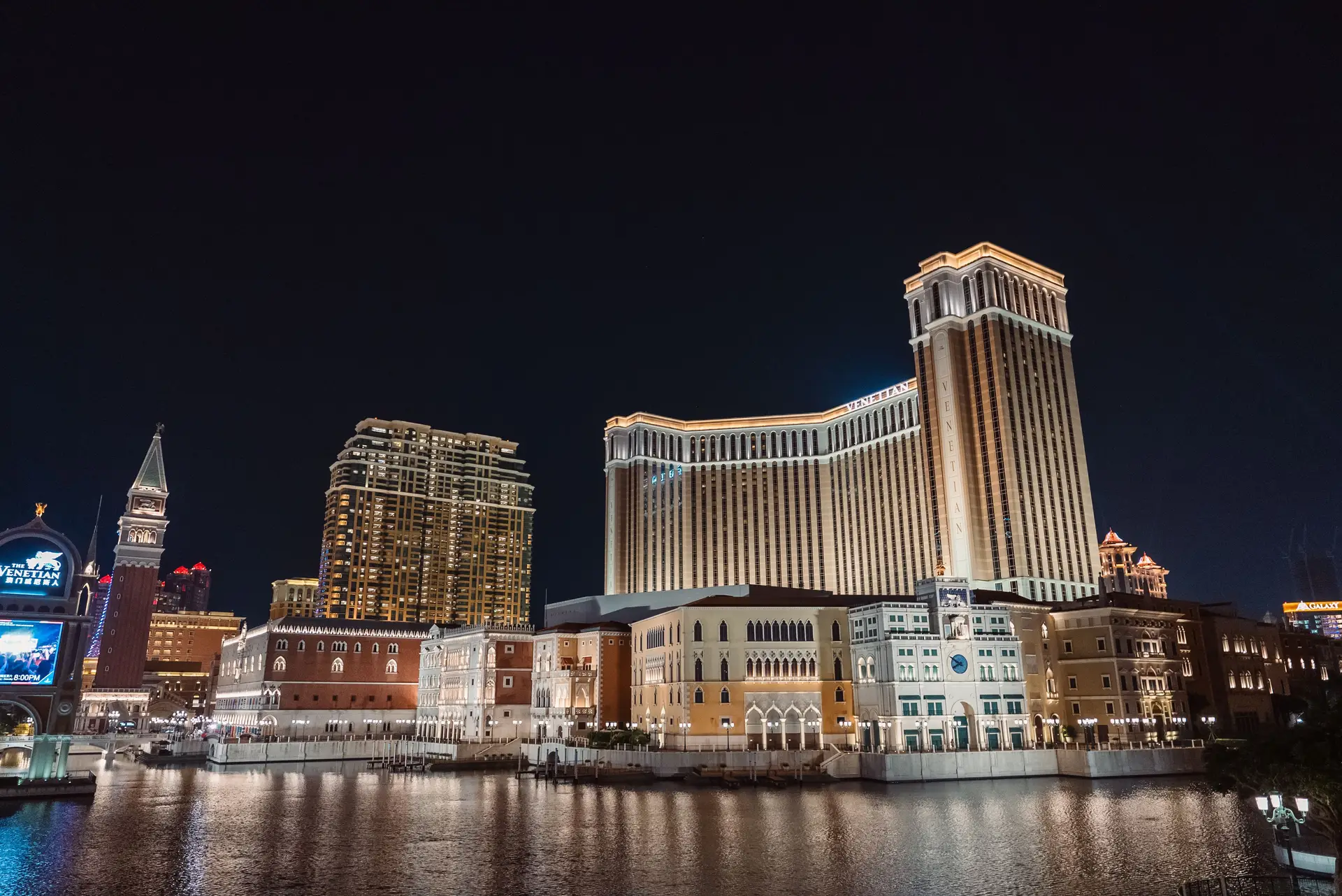 Glittering facade of international luxury casino resort at twilight