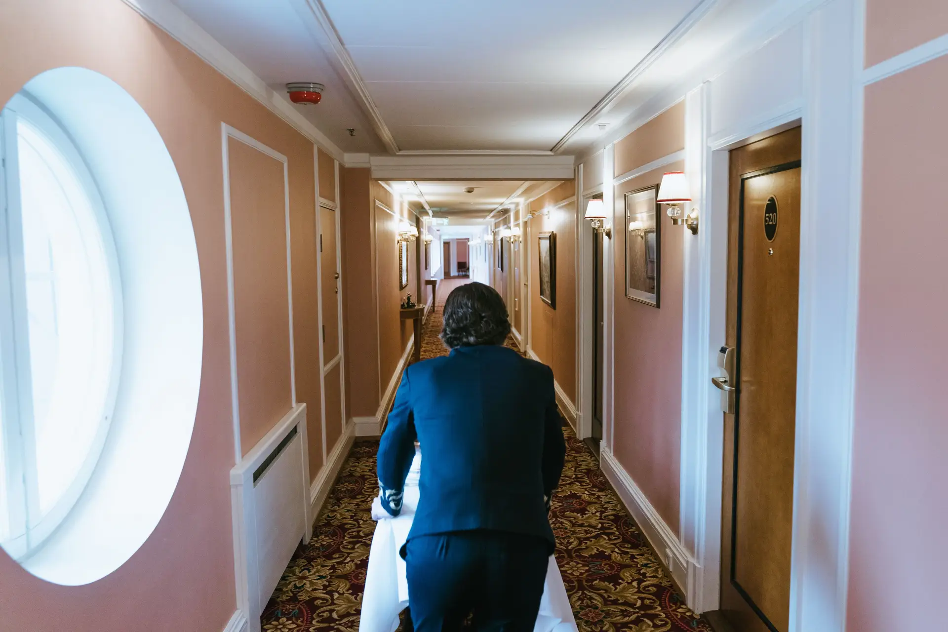 Concierge service delivering executive hospitality in luxury corridor