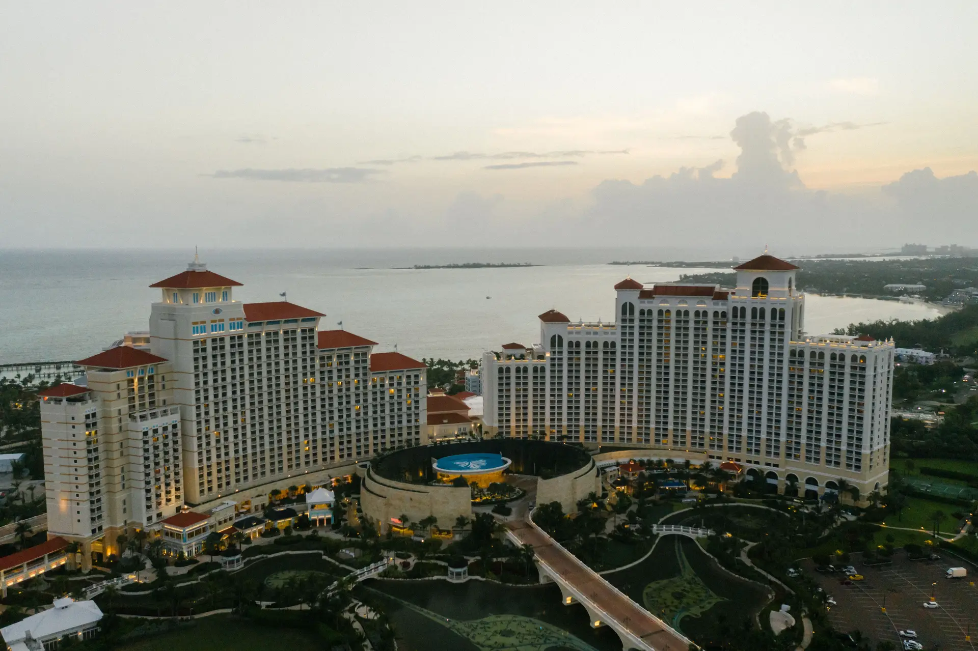 Aerial view of coastal luxury waterfront resort sanctuary at sunset